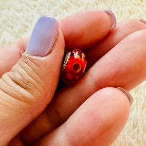 Original Pandora charm. Red/orange Murano. Used; excellent conditions.